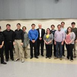 Curtis Olson with trombone studio students in posed photo.